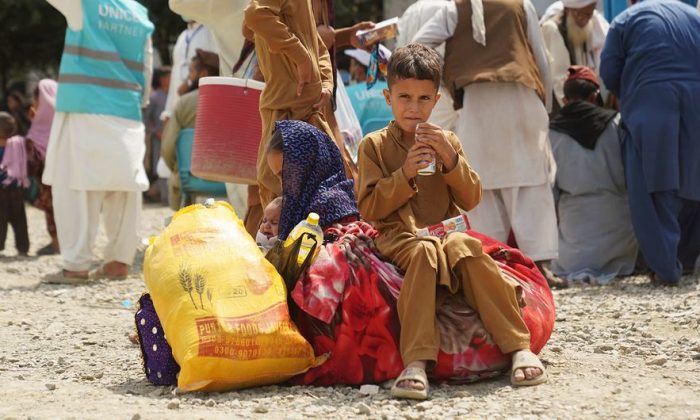 Amidst uncertainty, a helpline in Pakistan becomes a lifeline for Afghans